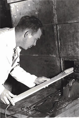 Elmer Rylander inserting corn tassels into the thermal column of CP-3